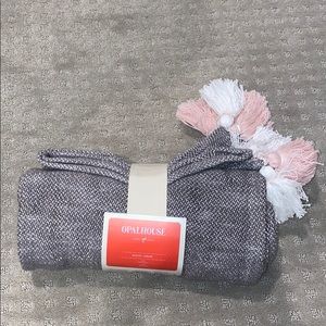 Woven pink, gray and white target throw.